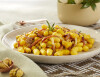 Potato and squash chicche with speck and chestnuts
