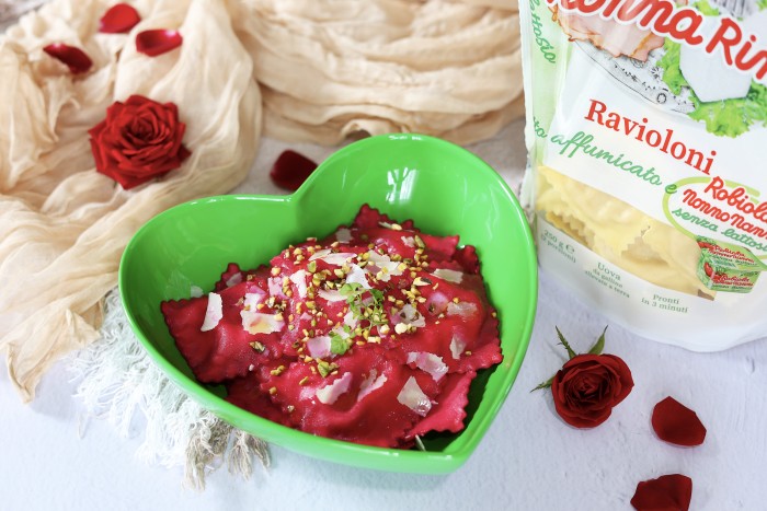 Ravioloni smoked ham and lactose-free robiola cheese with red beetroot, chopped pistachios, and Parmigiano Reggiano cheese